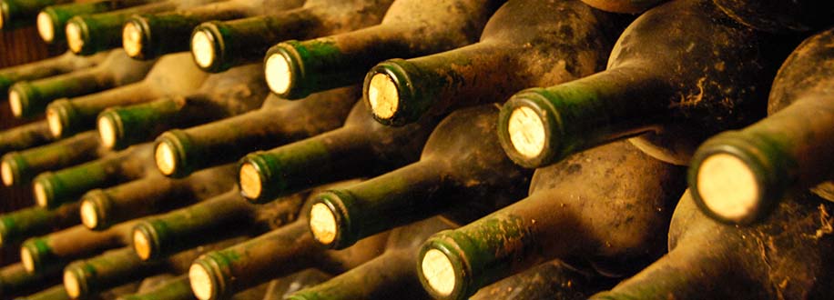 dust-covered bottles of aging wine at Ficklin Vineyard, Madera, California